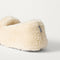 Close up of the heel of The Teddy Slipper in Oat Milk.