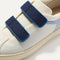 Close up of the vamp of The Kids Strap Sneaker in Blue Raspberry. 