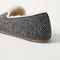 Close up of the heel of The Teddy Men's Slipper in Newsprint.