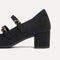 Close up of the heel on The Double Buckle Mary Jane Heel in Black.