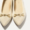 Close up of the toe and hardware detail on The Double Bit Point II in Cream.