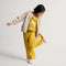 model | Alternate view of a child wearing The Teddy Kids Slipper in Oat Milk.