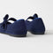 Close up of the heel of The Kids Tux Bow Mary Jane in ReVelvet™ Deep Navy.