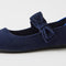 Close up of the bow detail of The Kids Tux Bow Mary Jane in ReVelvet™ Deep Navy.