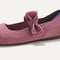 Close up of the bow detail of The Kids Tux Bow Mary Jane in ReVelvet™ Lilac.