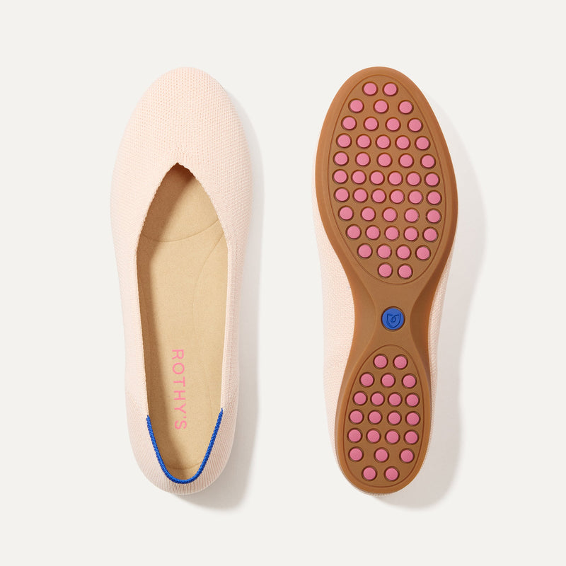 PLP |The Daily Flat in Bubbly Pink shown from the top with one shoe showing the outsole. 