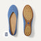 The Daily Flat in Clear Blue shown from the top with one shoe showing the outsole. 