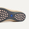 The outsole of The Daily Flat in Ecru with raised pegs for extra support. 