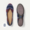 The Daily Flat in Fig Stripe shown from the top with one shoe showing the outsole. 