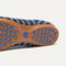 The outsole of The Daily Flat in Harbor Cabana Stripe with raised pegs for extra support. 