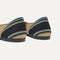 Close up of the heel of The Daily Flat in Hickory Stripe, with Rothy's signature blue halo. 