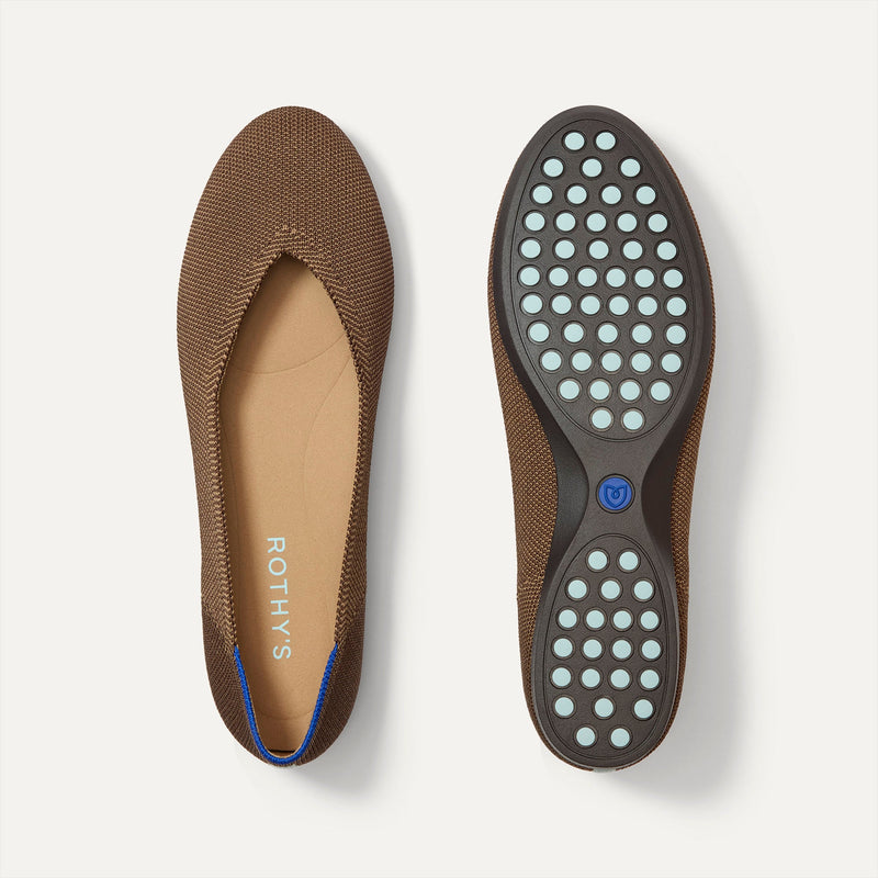 PLP |The Daily Flat in Minx shown from the top with one shoe showing the outsole. 