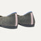 Close up of the heel of The Daily Flat in Salt Air, with Rothy's signature blue halo. 