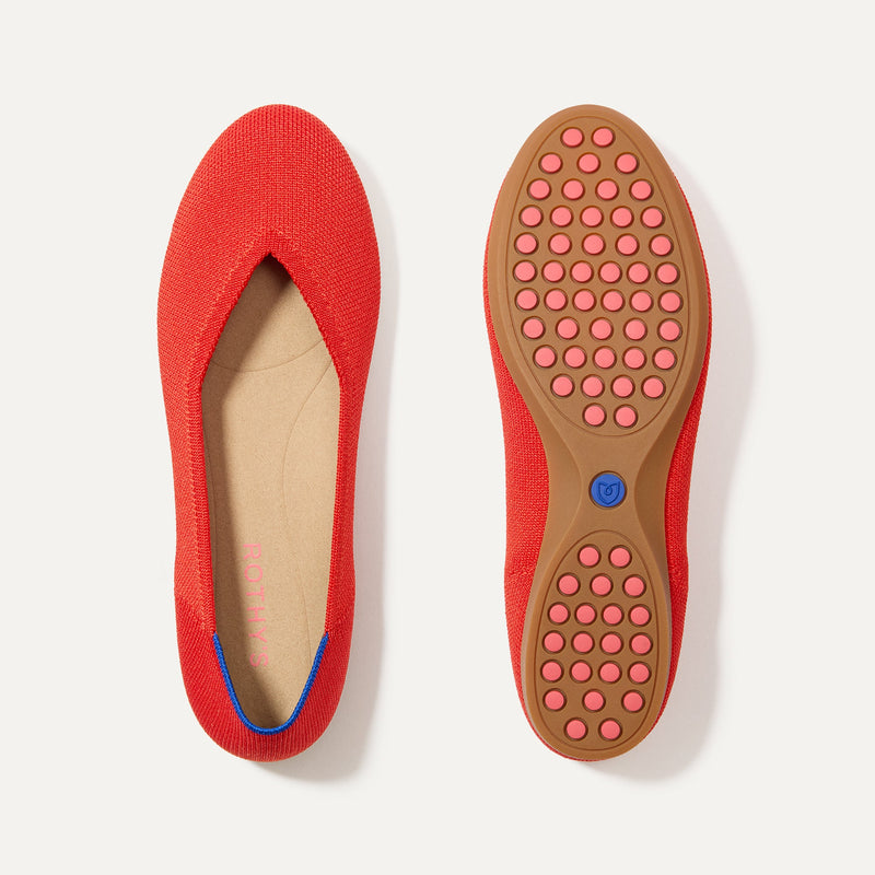 PLP |The Daily Flat in Showstopper Red shown from the top with one shoe showing the outsole. 