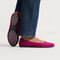 hover | Model wearing The Daily Flat in Wild Berry. 