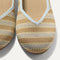 Close up of the toe and vamp of The Daily Flat in Terra Stripe. 