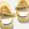 Close up of the heel of The Kids Clog in Sunny Crochet, with Rothy's signature blue halo. 