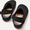 The back heel of The Kids Clog in Black showing the hook and loop straps.