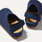 Close up of the back heel strap of The Kids Clog in Deep Navy. 