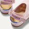 Close up of the heel of The Kids Clog in Pink Crochet, with Rothy's signature blue halo.