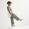 Alternate view of a model wearing The Kids Clog in Soft Orchid. 
