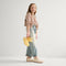 Alternate view of a child wearing The Kids Clog in White Crochet. 
