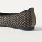 Close up of the heel of The Almond Ballet in Bronzite Lattice, with Rothy's signature blue halo.