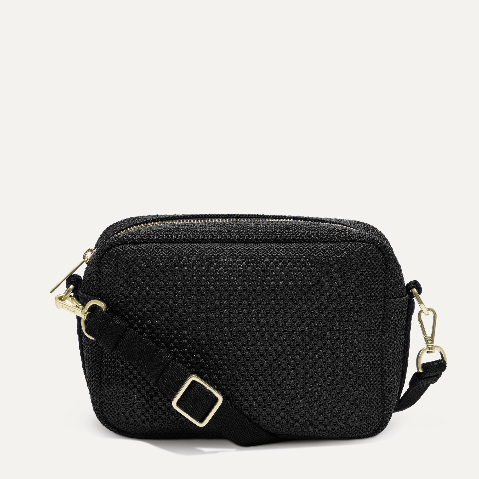 PDP |The Crossbody Camera Bag in  Black Licorice Open-Knit, shown from the front. 
