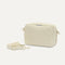 The Crossbody Camera Bag in Cream Twist Open-Knit shown by itself with removable strap. 