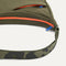A closeup of The Travel Sling in Forest, showing the smooth zipper closure and soft, flexible handle.
