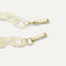 A close-up of The Shoulder Strap in Opal White Chain, focusing on the end snap hooks. 