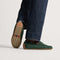 hover | Model wearing The Men's Driver in Dark Green. 