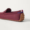 Close up of the heel of The Men's Driver in Syrah, with raised peg outsoles and Rothy's signature blue halo. 