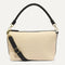 PDP |The Daily Crossbody Bag in Black and White Raffia-Knit shown from the front.