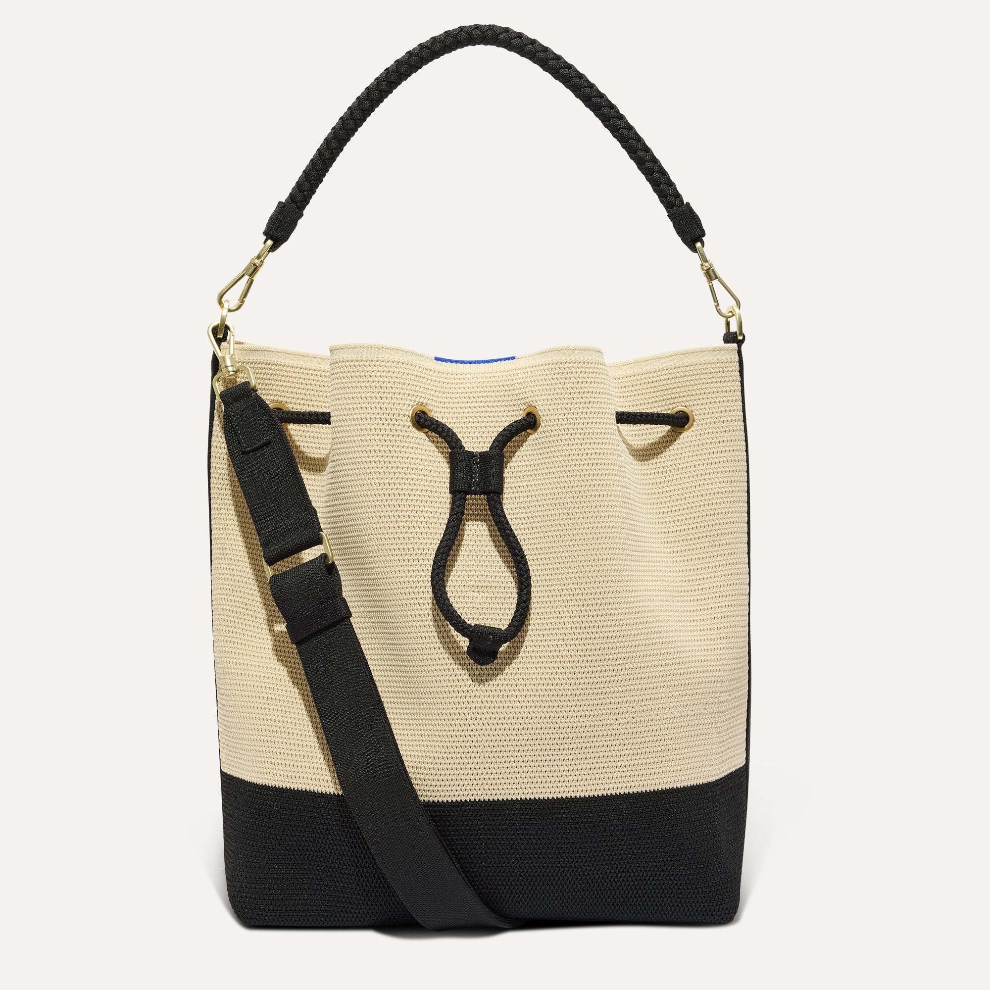PDP |The Cinch Bucket Bag in Black and White Raffia-Knit shown from the front.