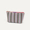The Small Travel Pouch Set in Watermelon Market Stripe shown from the side.