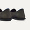 Close up of the heel of The Cruiser Loafer in ReVelvet Jet Herringbone, with Rothy's signature blue halo. 