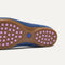 Close up of the supportive peg outsoles of The Daily Loafer in Blue Trench. 