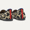Close up of the heel of The Daily Loafer in Desert Cat, with raised peg outsoles and Rothy's signature blue halo. 