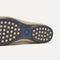 Close up of the supportive peg outsoles of The Daily Loafer in Ecru. 