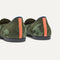 Close up of the heel of The Daily Loafer in Green Camo, with raised peg outsoles and Rothy's signature blue halo. 