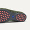 Close up of the supportive peg outsoles of The Daily Loafer in Green Camo. 
