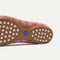 Close up of the supportive peg outsoles of The Daily Loafer in Sunkiss Stripe. 
