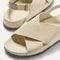 Close up of the crossing knit straps and toe of The Weekend Sandal in Coconut.