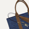 Close up of the handles and key leash detail of The Lightweight Tote in Dusk Open-Knit. 