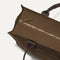 The Classic Tote in Cinnamon Open Knit, shown from above, with the top zipper closed. 