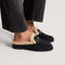 hover | Model wearing The Après Loafer Mule in ReVelvet Black.