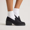 hover | Model wearing The Block Heel Loafer in Black. 