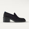 side | The Block Heel Loafer in Black shown from the side. 