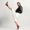 Alternate view of a model wearing The Ivy Sneaker in ReVelvet Cheetah. 